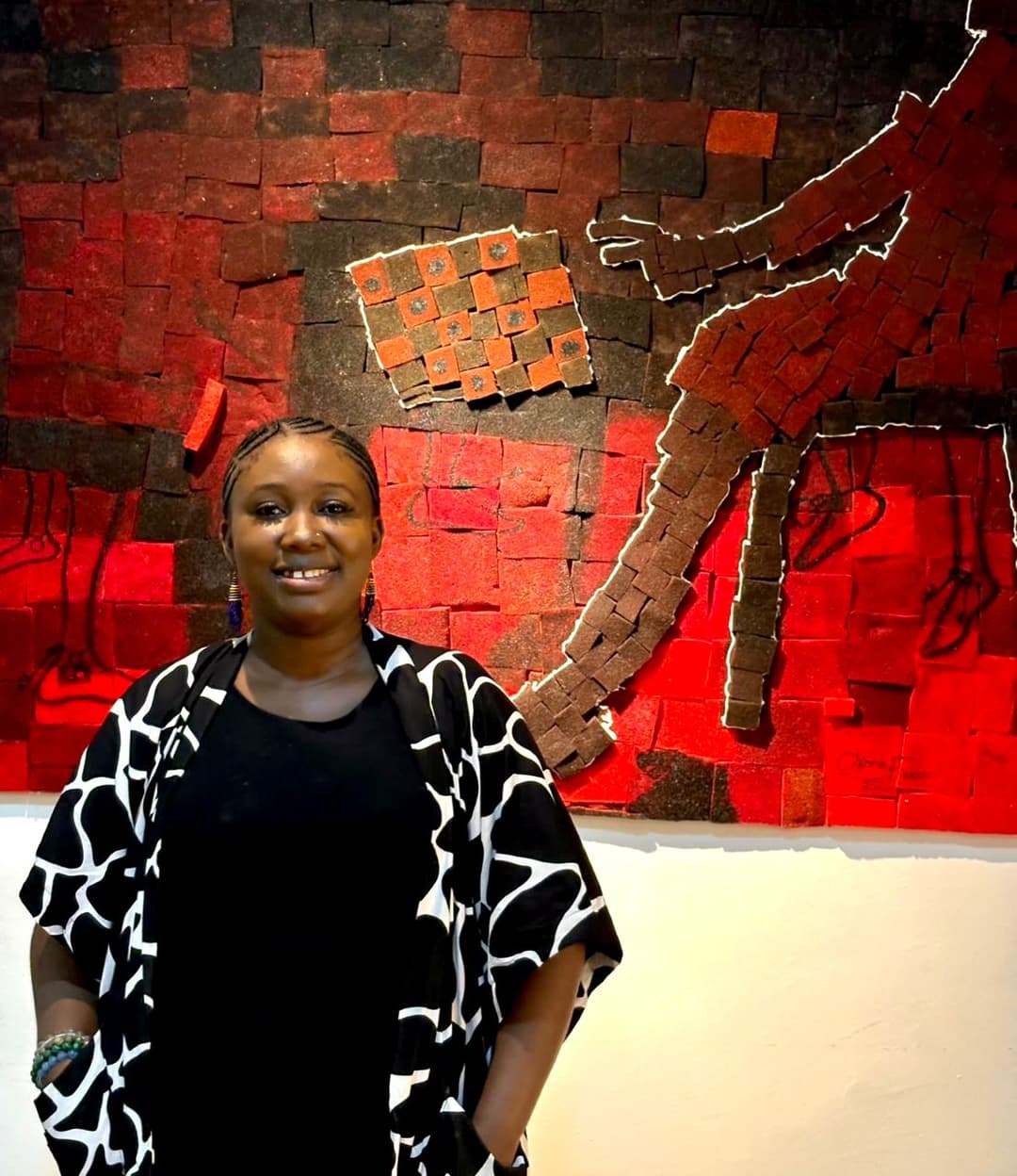 Chioma viewing her artwork